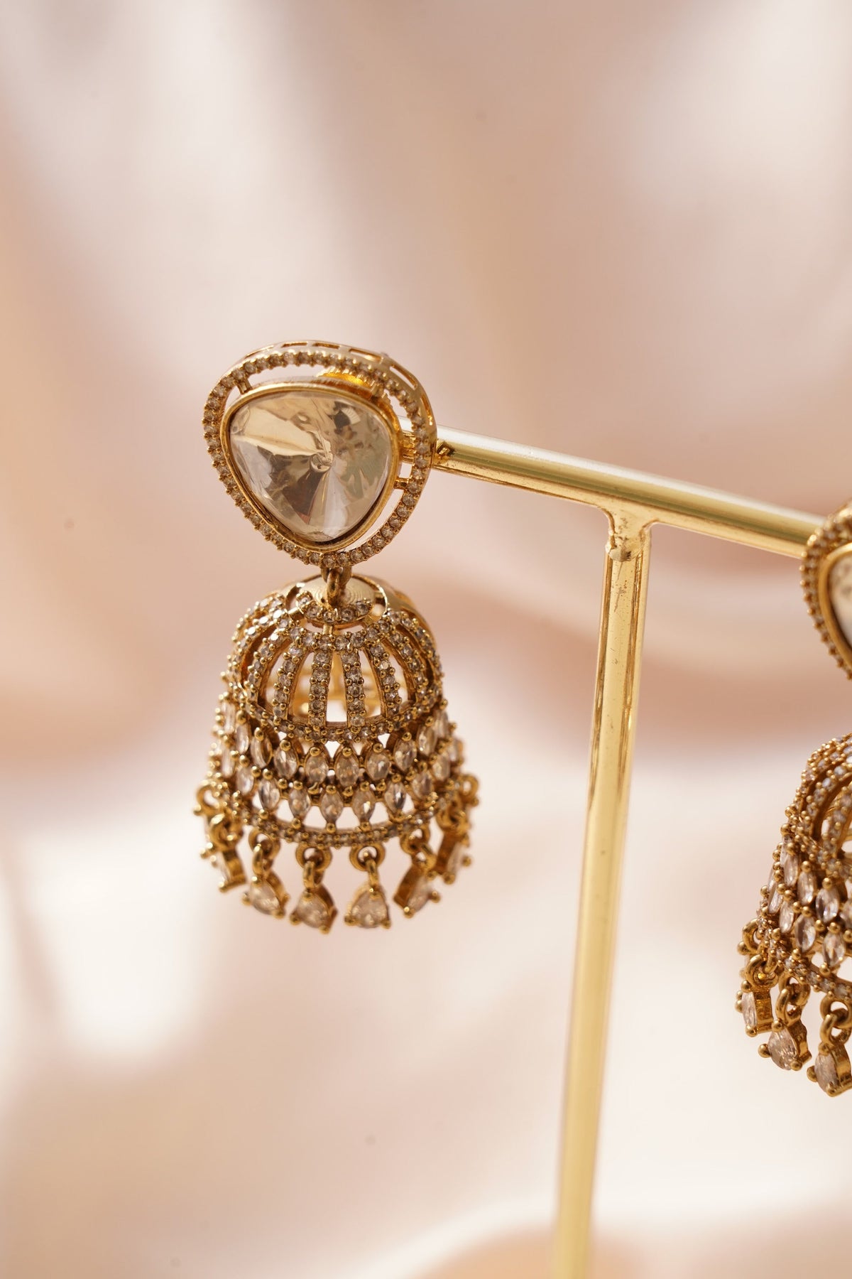 Gold jhumka with champagne stones