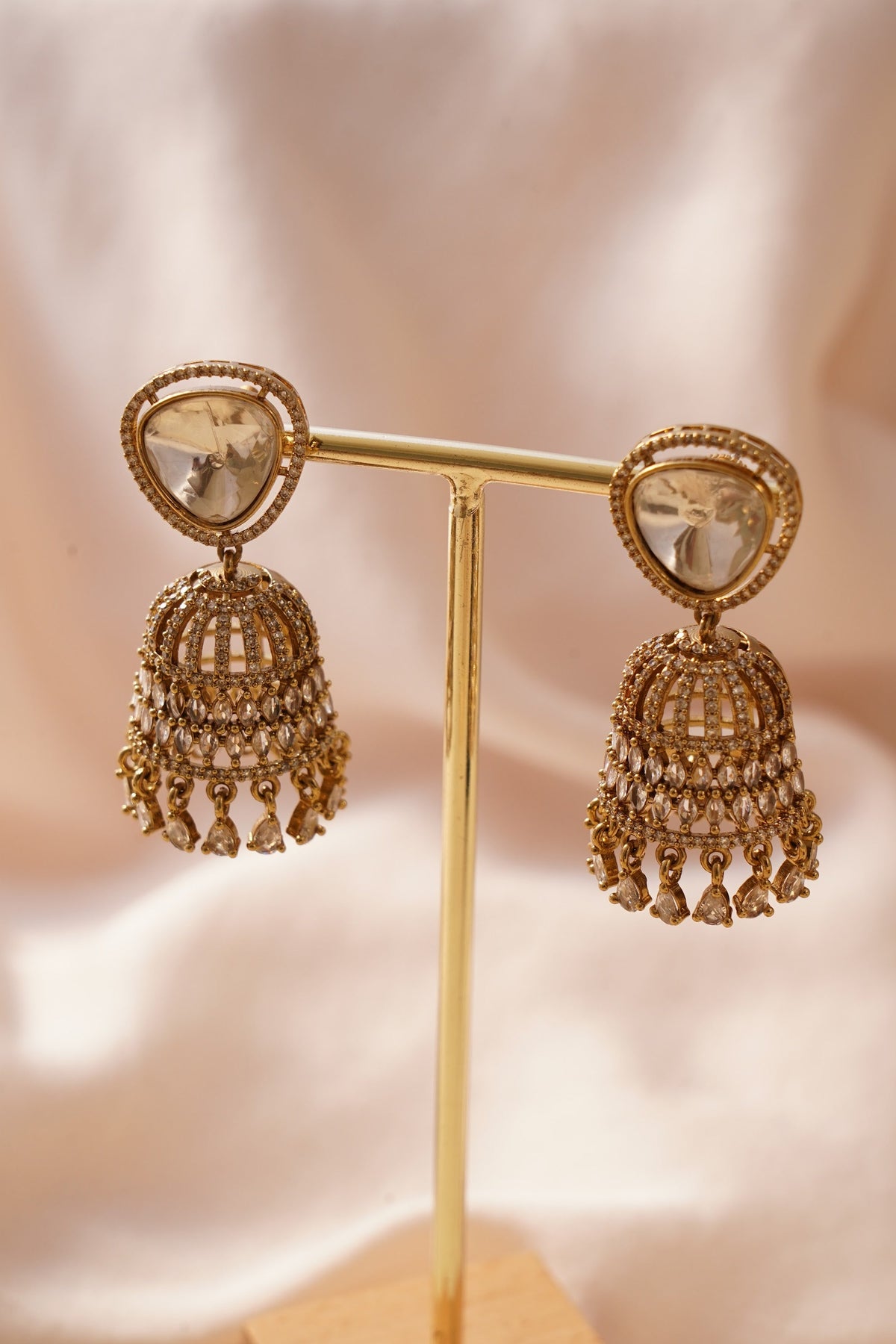 Gold jhumka with champagne stones